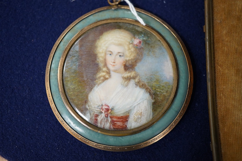 A 19th century, Italian portrait miniature of a lady with flowers, oval watercolour on ivory, indistinctly signed Biagiotti?, housed in an easel frame, together with another, housed in an inlaid and yellow metal pendant